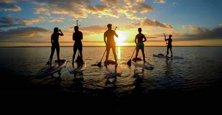 Sunrise beach paddle boarding